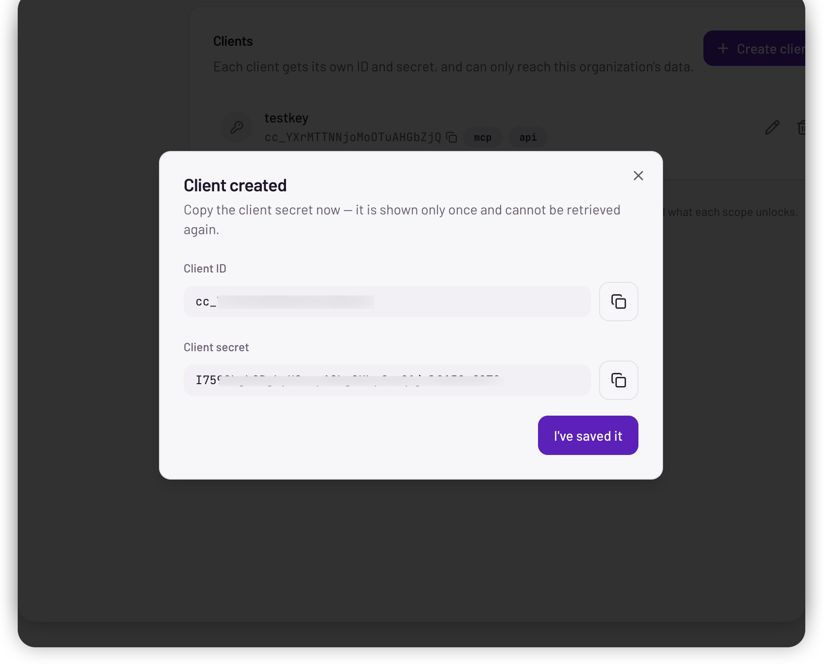 The Client created dialog, showing the client ID and client secret with copy buttons